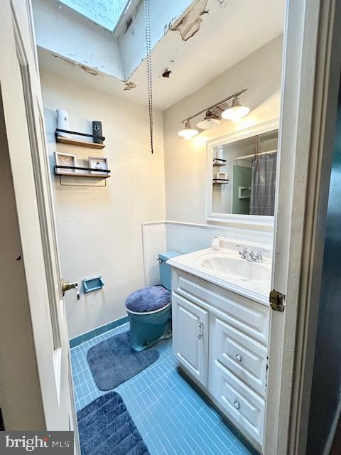 12405 Sweet Briar Road Philadelphia, PA 19154 - Photo 26 of 28 a bathroom with a granite countertop sink and a mirror