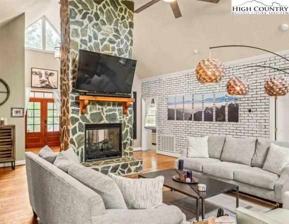 a kitchen with kitchen island granite countertop a sink stainless steel appliances and cabinets