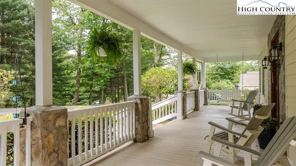 a view of a two chairs in the balcony