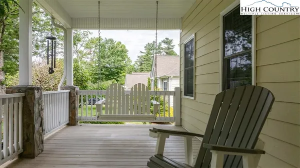 a view of balcony with furniture