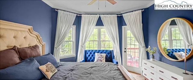 a bedroom with a bed and a chair