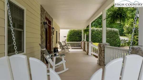 a view of balcony with furniture