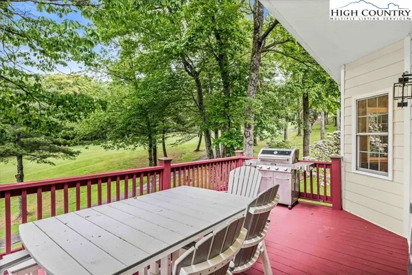 a table and chairs in front of a house