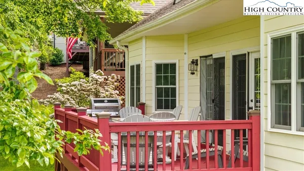 an aerial view of a house with a yard basket ball court and outdoor seating