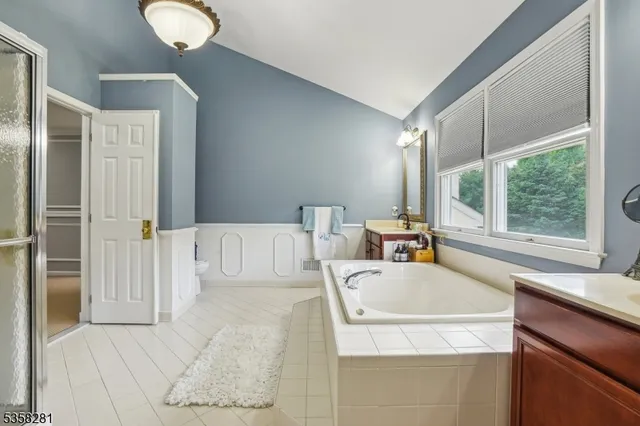 a bed room with a bed and a large window