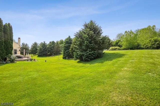 a view of a golf course with a lake view