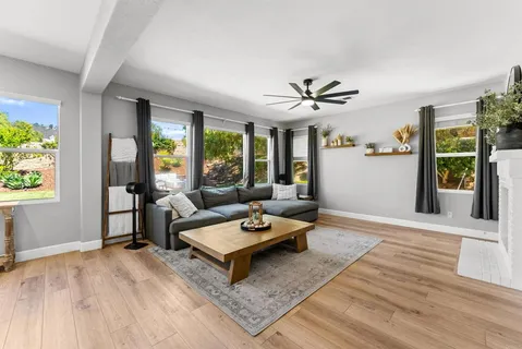 a living room with furniture and a table