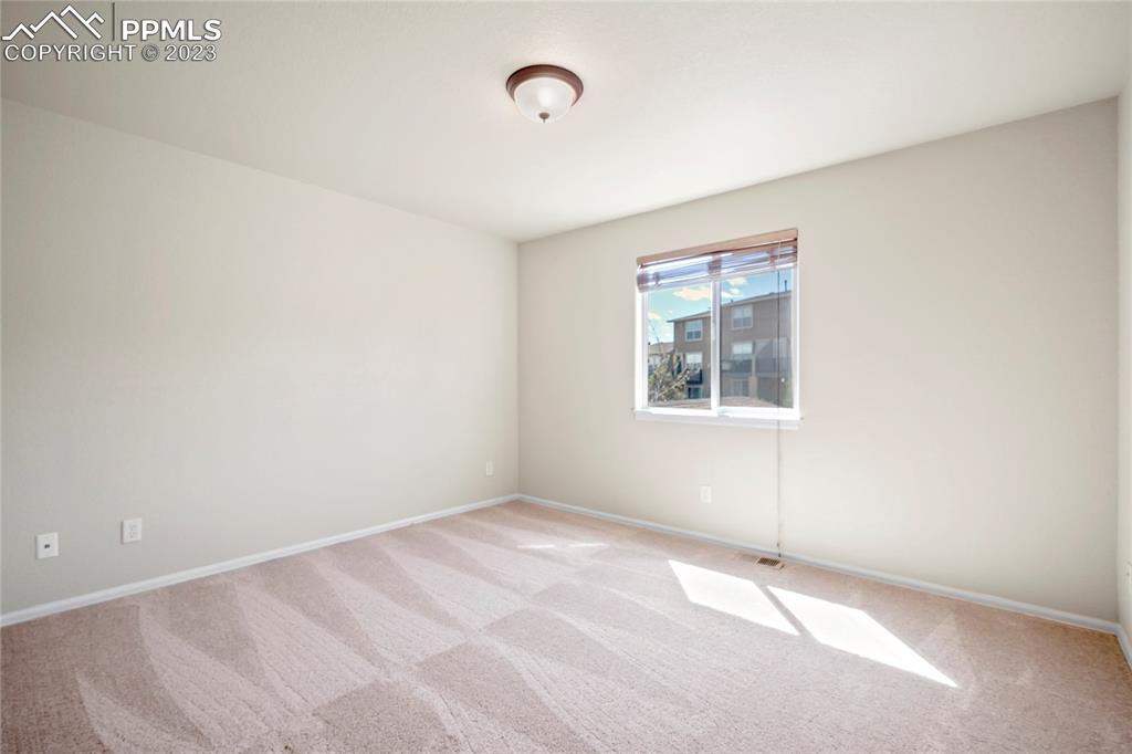 3822 Homestead Ridge Heights Colorado Springs, CO 80917 - Photo 11 of 17 a view of an empty room with a window