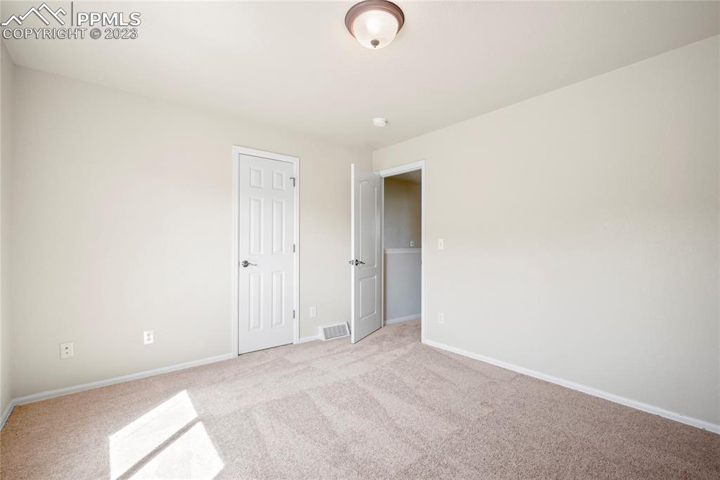 3822 Homestead Ridge Heights Colorado Springs, CO 80917 - Photo 12 of 17 a view of a room with wooden floor