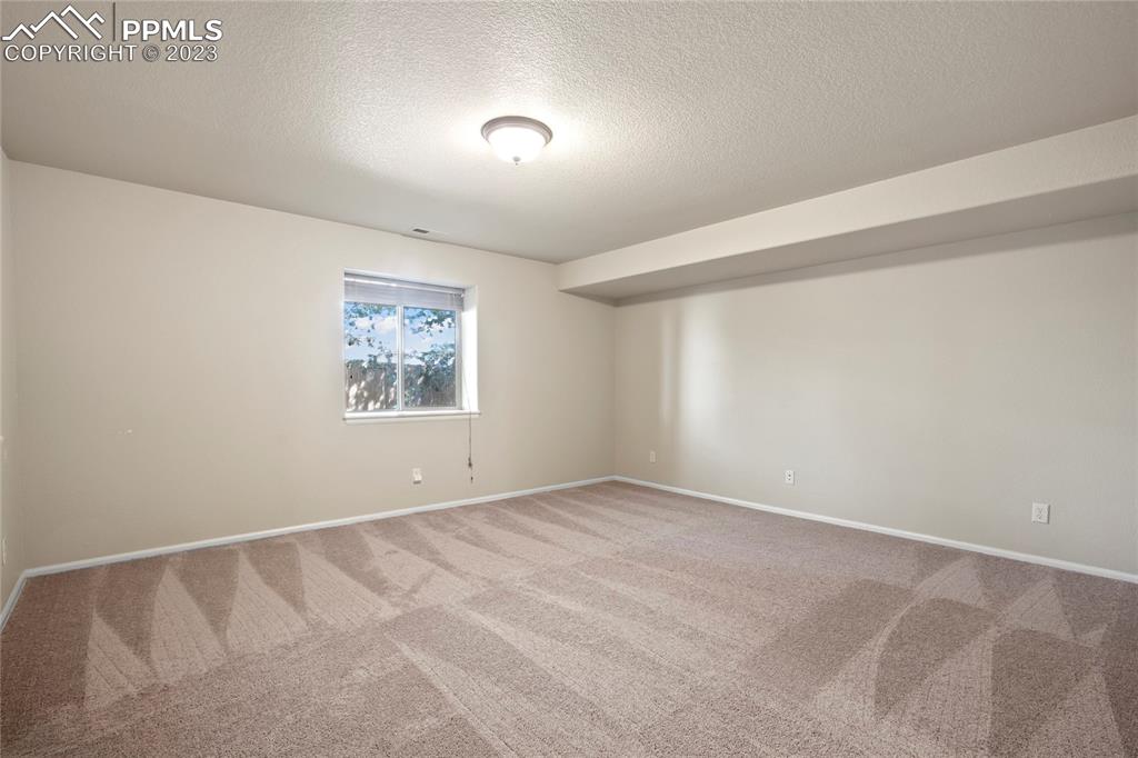 3822 Homestead Ridge Heights Colorado Springs, CO 80917 - Photo 13 of 17 an empty room with windows