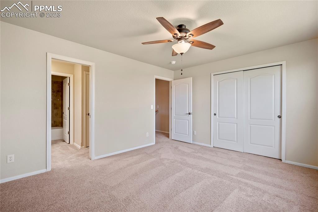 3822 Homestead Ridge Heights Colorado Springs, CO 80917 - Photo 9 of 17 a view of an empty room with a ceiling fan