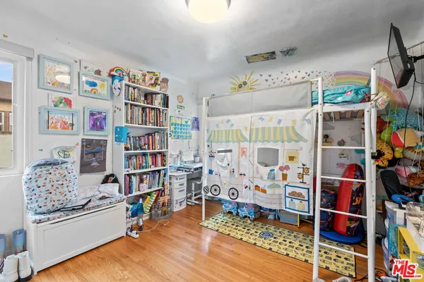 a room with furniture and a book shelf