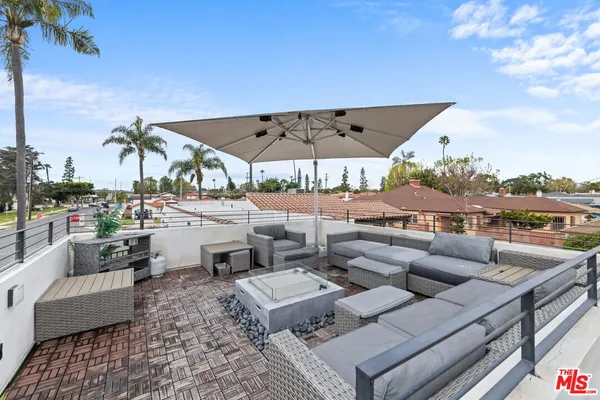 an outdoor space with patio the couches and pool view