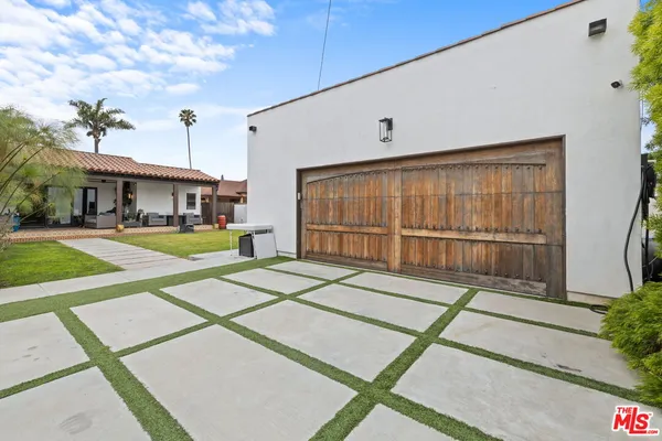 a view of a house with a backyard and a patio
