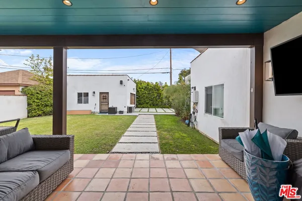 a view of a patio with couches and a table