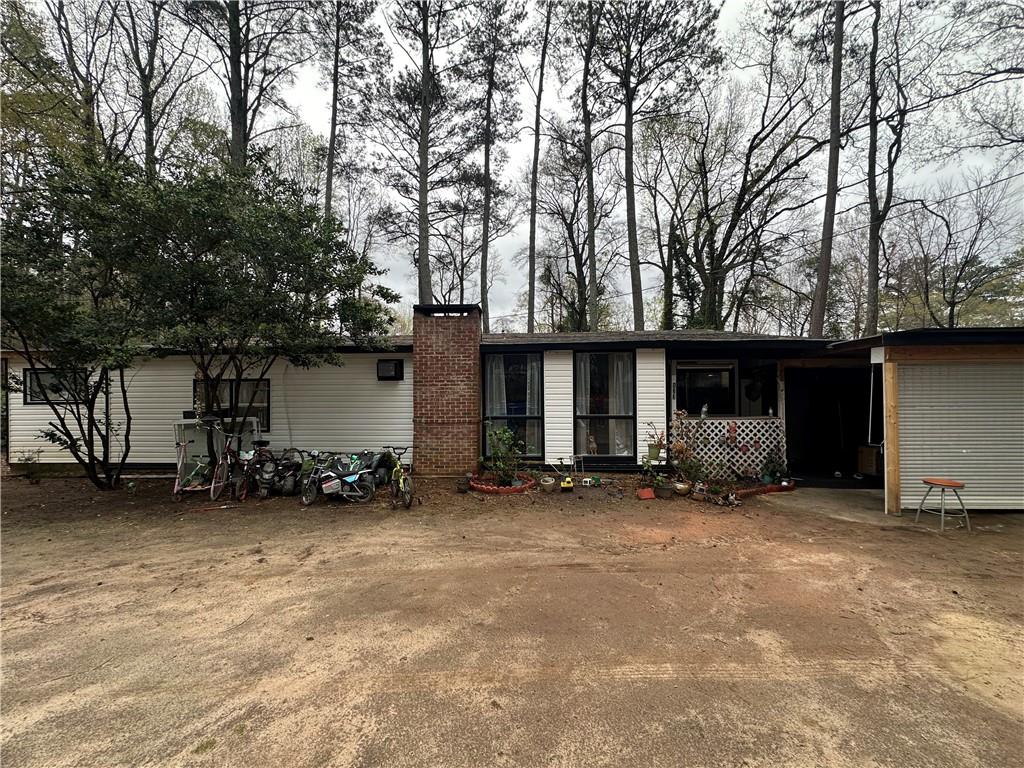 123 Spring Street Stockbridge, GA 30281 - Photo 1 of 47 a big house with trees in front of it