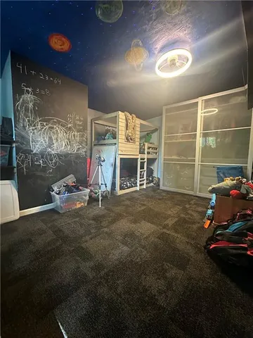 a view of a swimming pool and chairs