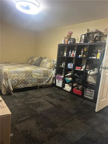 a bathroom with a sink a toilet a mirror and vanity