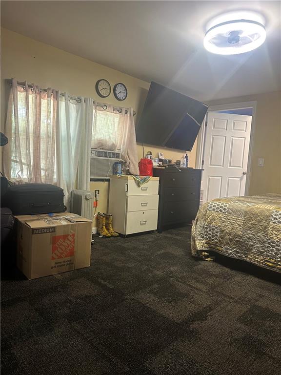 123 Spring Street Stockbridge, GA 30281 - Photo 28 of 47 a bedroom with a bed and large windows