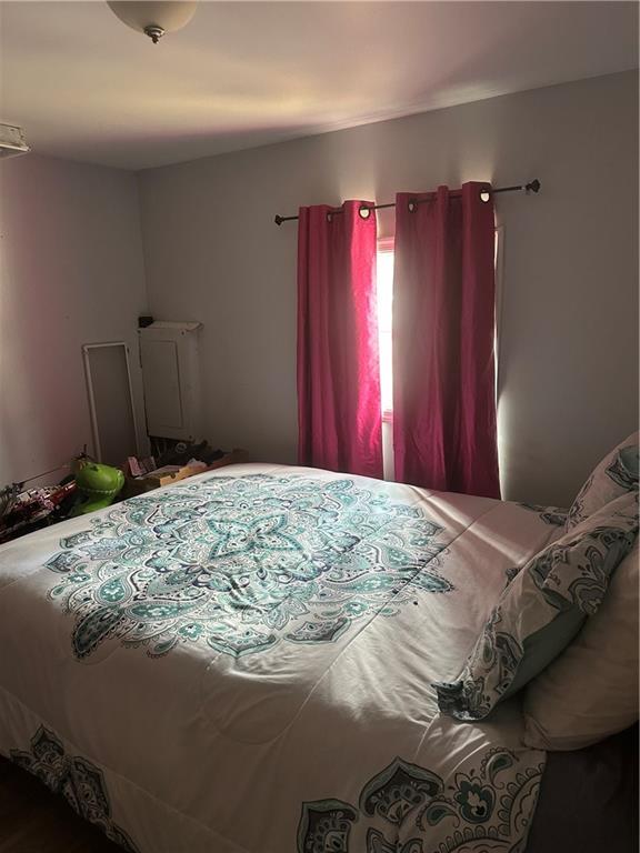 123 Spring Street Stockbridge, GA 30281 - Photo 30 of 47 a bed sitting in a bedroom next to a window