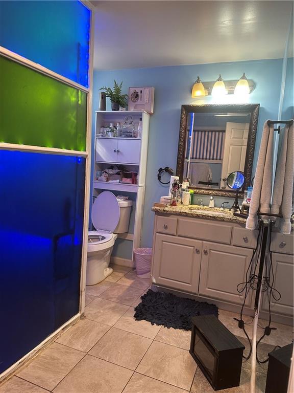 123 Spring Street Stockbridge, GA 30281 - Photo 33 of 47 a kitchen with a refrigerator wooden floor and cabinets