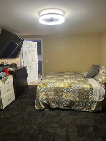 a view of a dining room with furniture and a chandelier