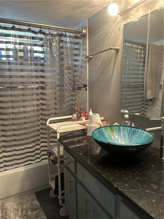123 Spring Street Stockbridge, GA 30281 - Photo 39 of 47 a bathroom with a granite countertop sink and a mirror