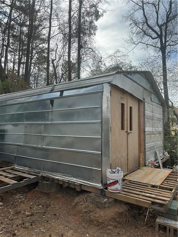 123 Spring Street Stockbridge, GA 30281 - Photo 47 of 47 a room with a bench and trees