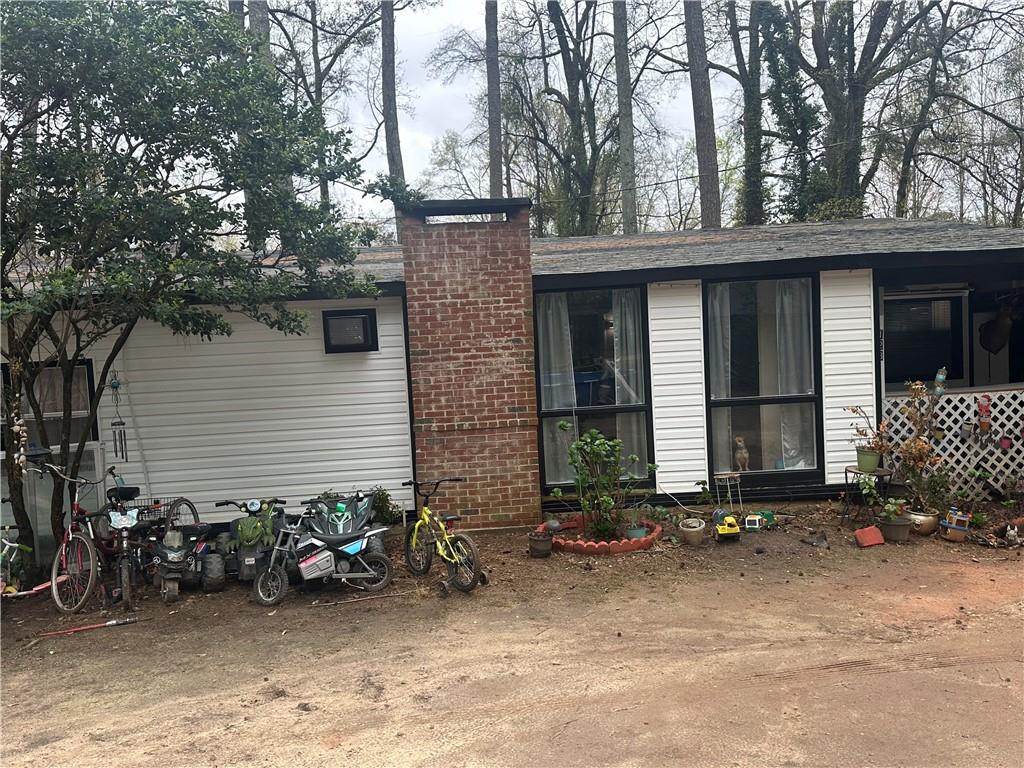 123 Spring Street Stockbridge, GA 30281 - Photo 5 of 47 a view of a house with a patio and a yard