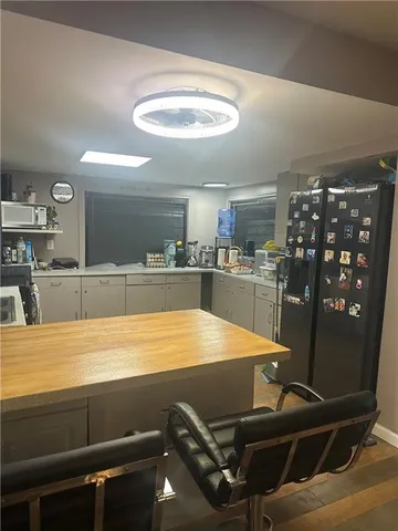 a room with furniture and air hockey table