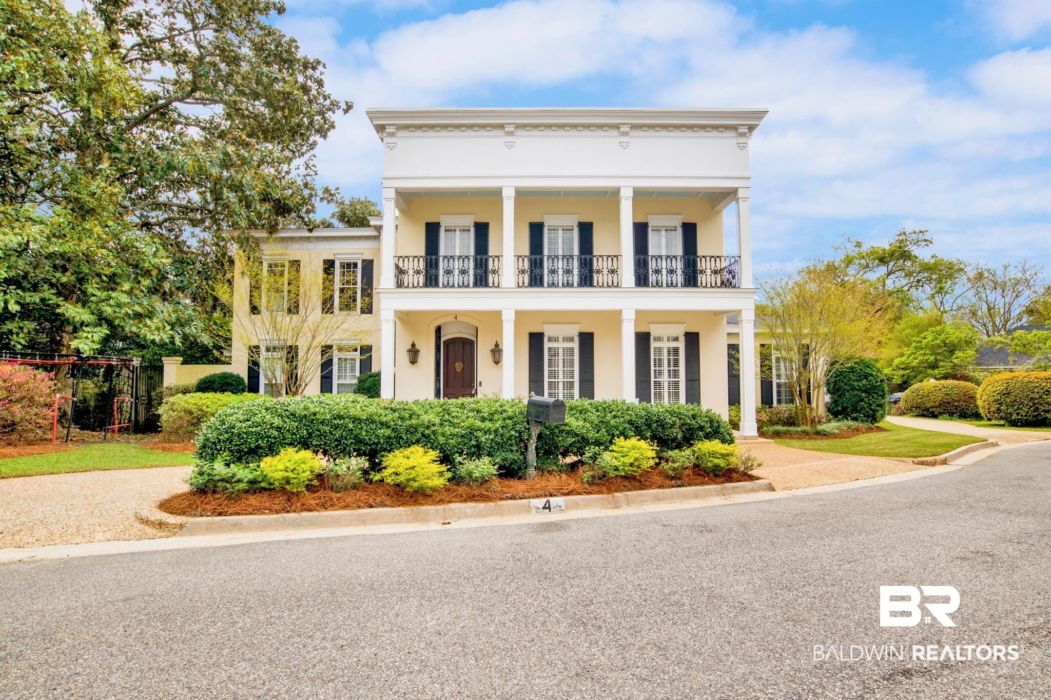 4 Savannah Court Mobile, AL 36608 - Photo 1 of 32 Neoclassical / greek revival house featuring stucco siding and a porch