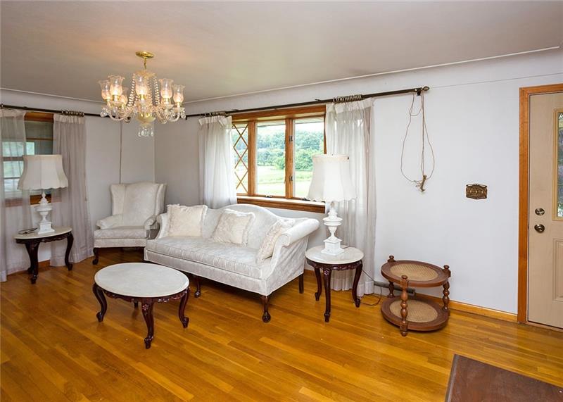 108 Warren Street Perryopolis, PA 15473 - Photo 3 of 20 Formal Living Room with gleaming hardwood floors