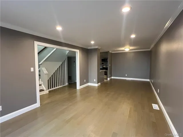 a view of entryway with wooden floor