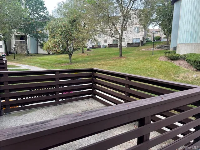 a view of a yard with outdoor seating
