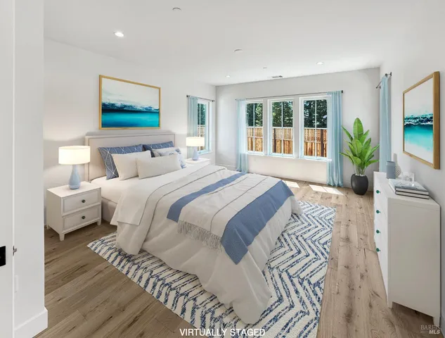 a bedroom with a large bed and a large window