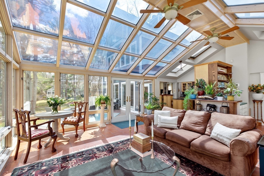 30 South River Street Wellesley, MA 02482 - Photo 12 of 29 a living room with furniture and a floor to ceiling window