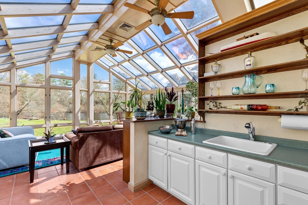 30 South River Street Wellesley, MA 02482 - Photo 13 of 29 a kitchen with a sink and large windows