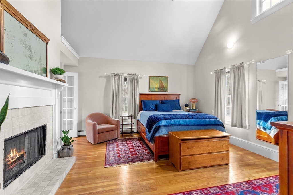 30 South River Street Wellesley, MA 02482 - Photo 18 of 29 a bedroom with furniture and a fireplace