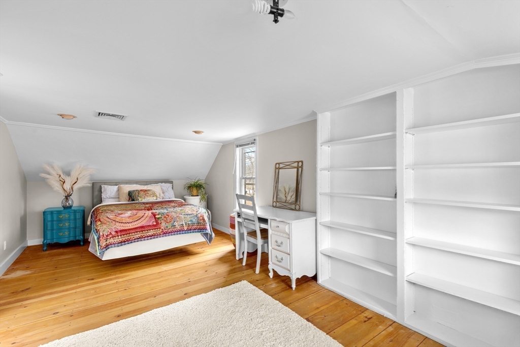 30 South River Street Wellesley, MA 02482 - Photo 19 of 29 a bedroom with a bed and a chair in it