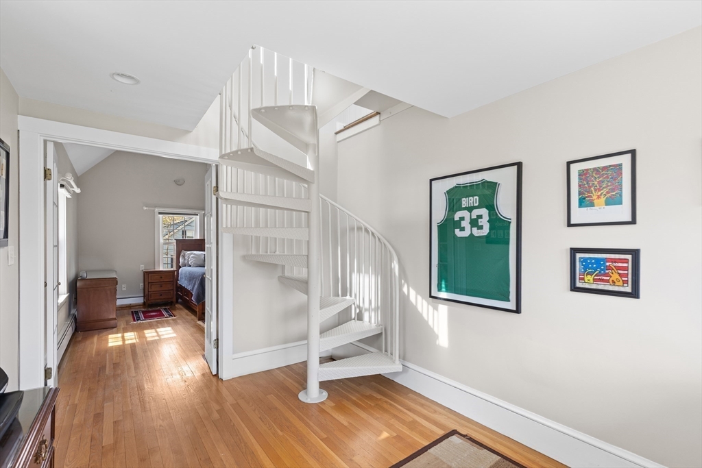 30 South River Street Wellesley, MA 02482 - Photo 21 of 29 a view of entryway with wooden floor and stairs