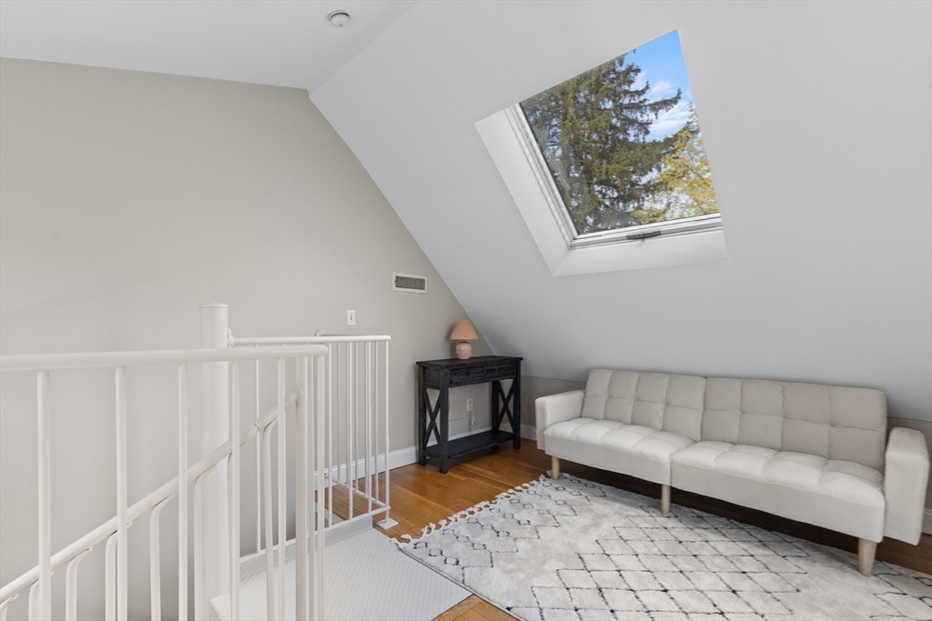 30 South River Street Wellesley, MA 02482 - Photo 23 of 29 a living room with furniture and a wooden floor