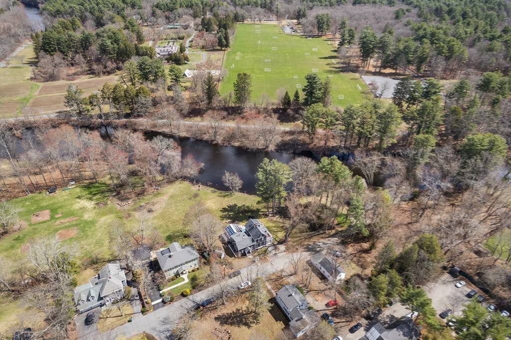 30 South River Street Wellesley, MA 02482 - Photo 28 of 29 a view of a lake with large trees