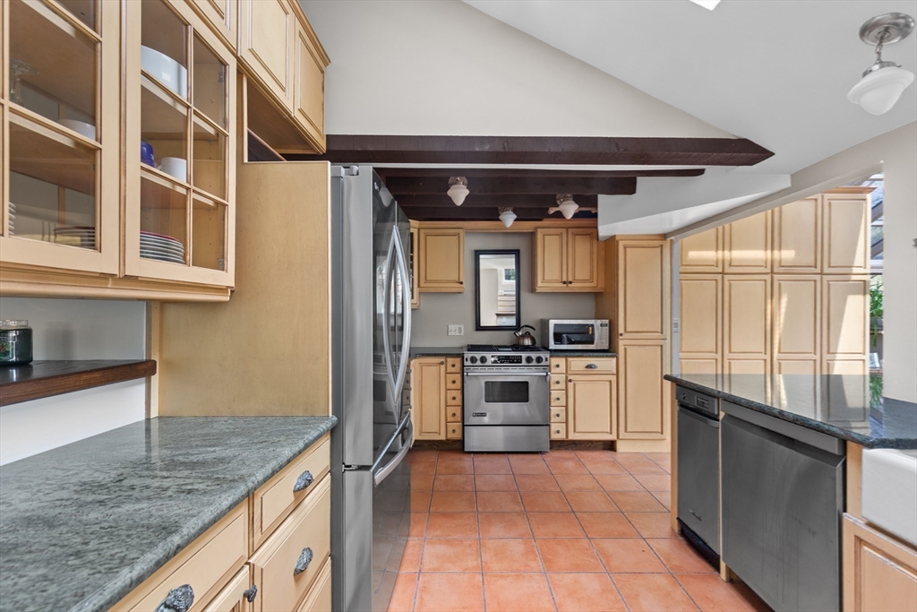 30 South River Street Wellesley, MA 02482 - Photo 5 of 29 a kitchen with stainless steel appliances granite countertop a stove and a sink