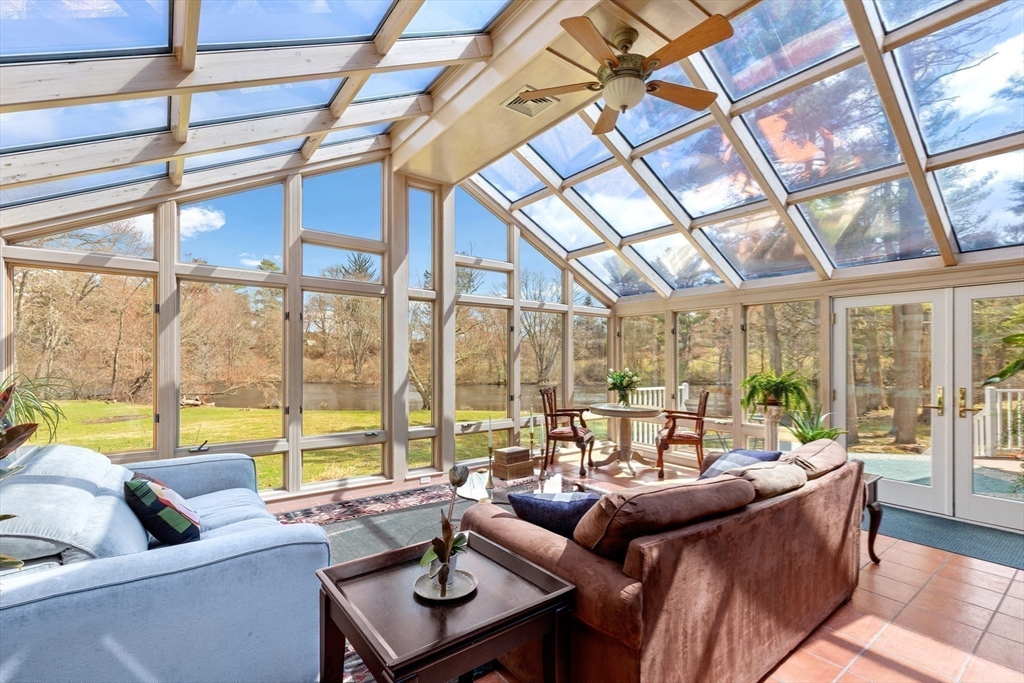 30 South River Street Wellesley, MA 02482 - Photo 10 of 29 a living room with furniture and floor to ceiling windows