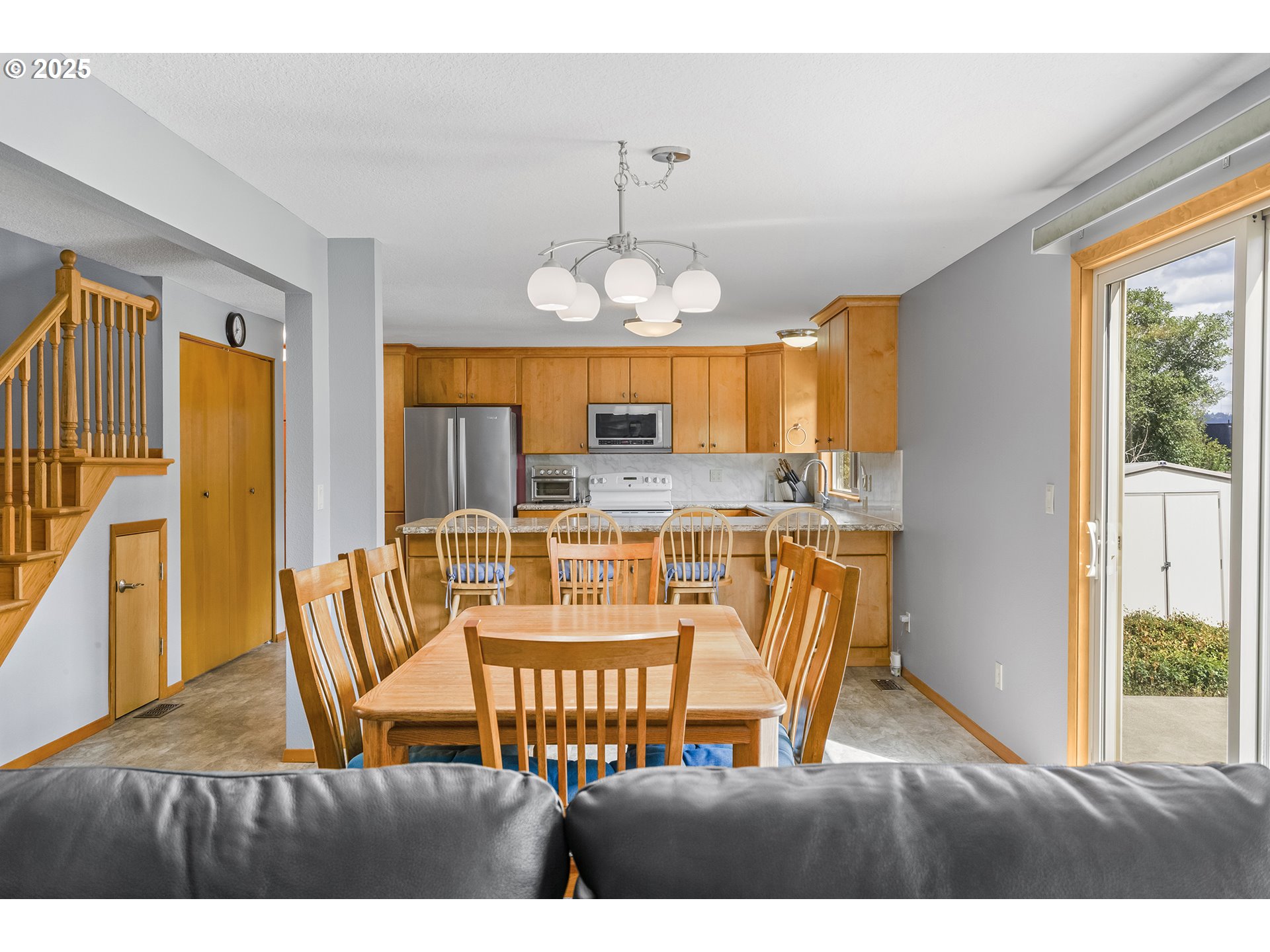 9630 Southwest Robbins Drive Beaverton, OR 97008 - Photo 11 of 35 a view of a dining room with furniture window and outside view