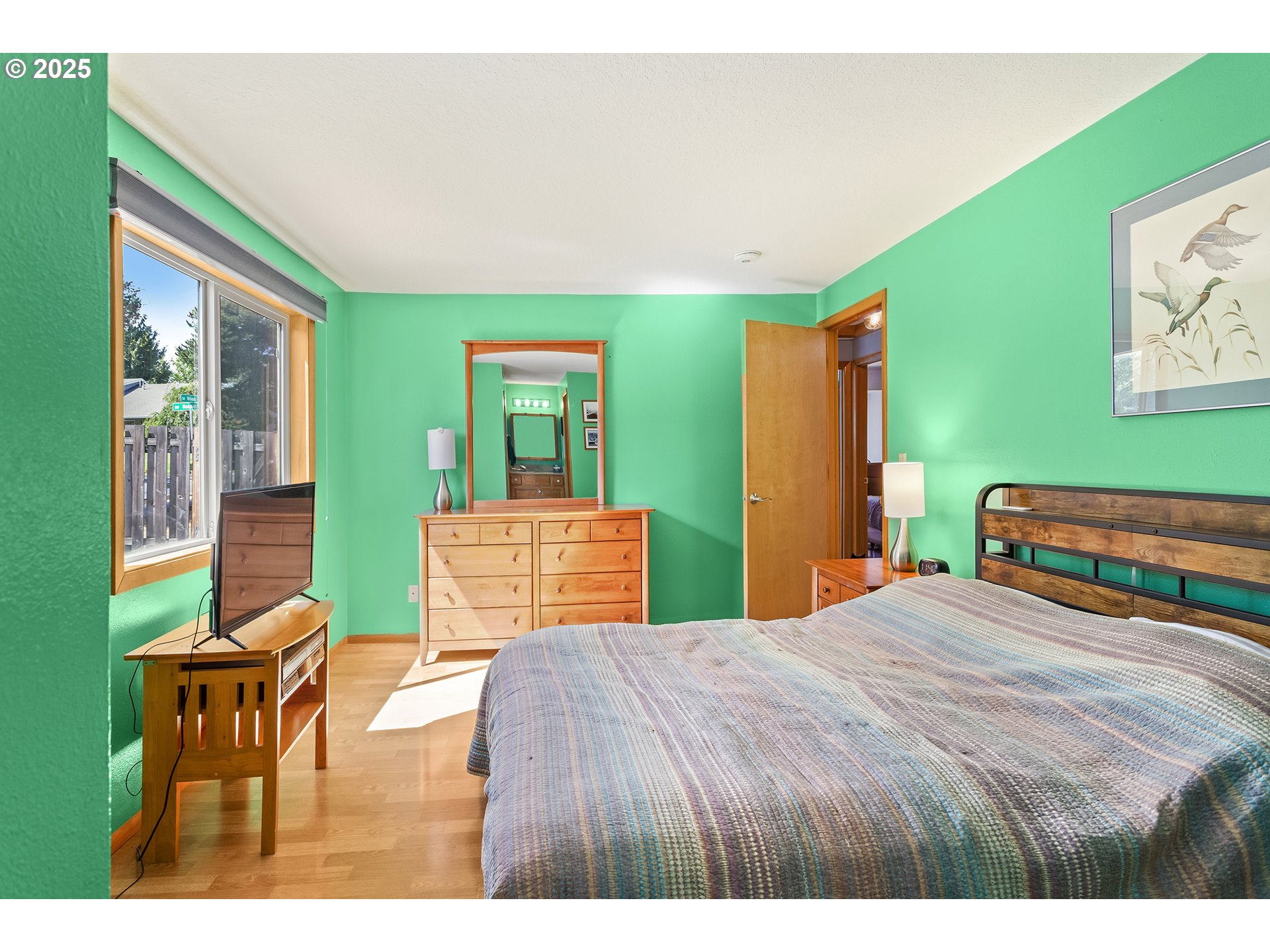 9630 Southwest Robbins Drive Beaverton, OR 97008 - Photo 16 of 35 a bedroom with a bed a table and chair