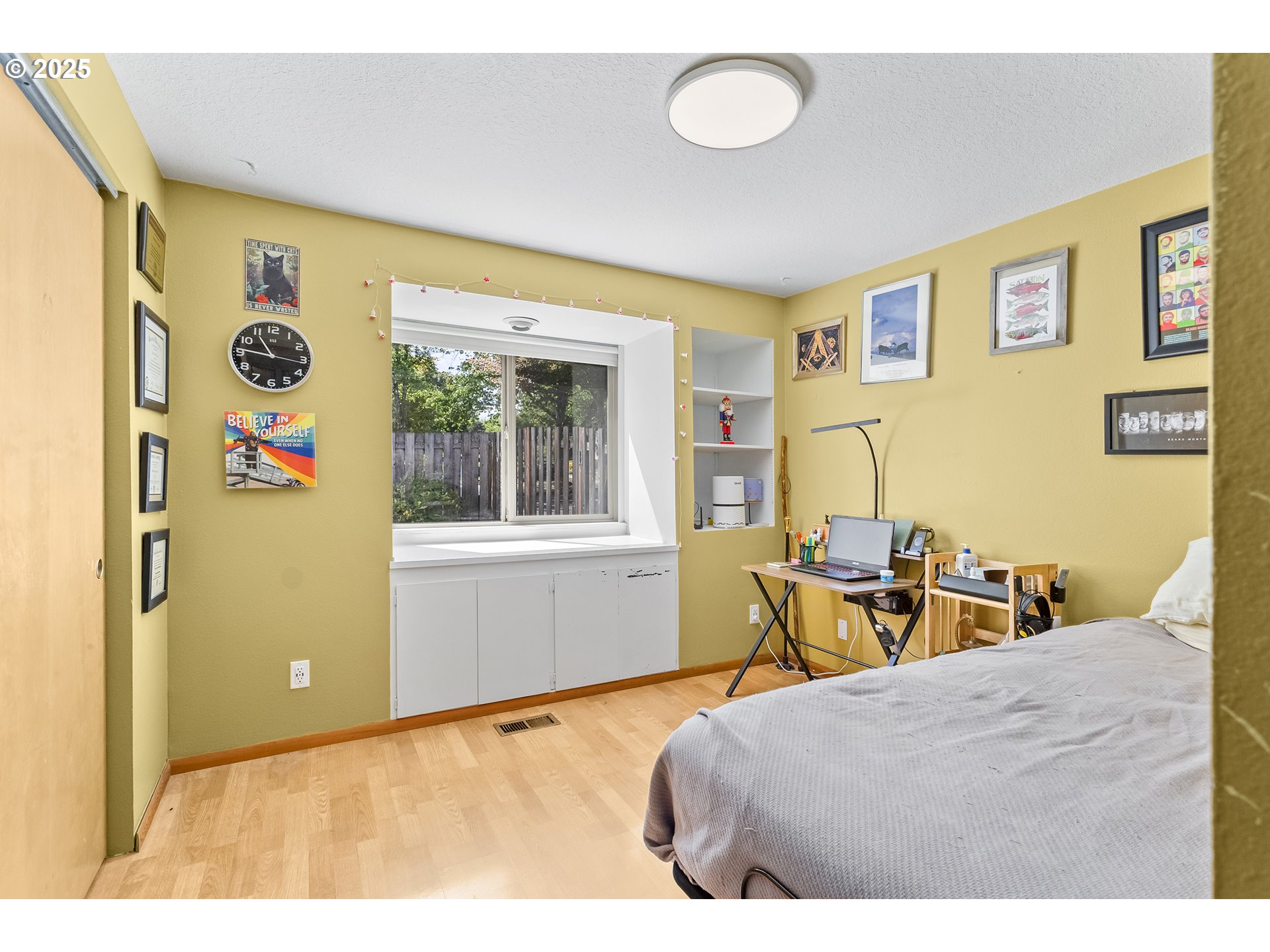 9630 Southwest Robbins Drive Beaverton, OR 97008 - Photo 20 of 35 a bedroom with a bed and wooden floor