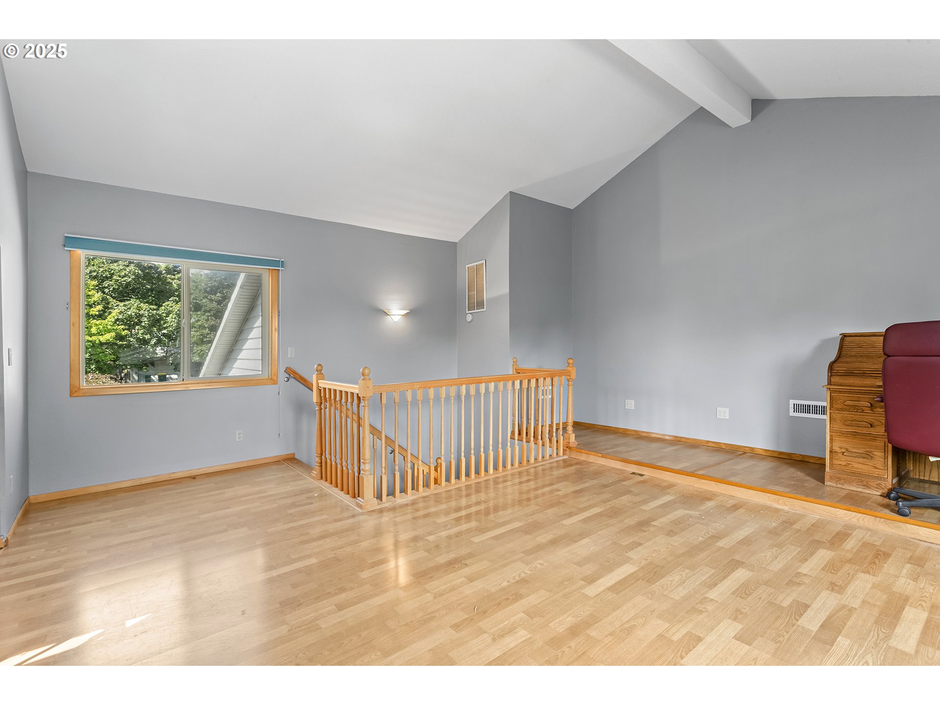9630 Southwest Robbins Drive Beaverton, OR 97008 - Photo 24 of 35 a view of an empty room with wooden floor and windows