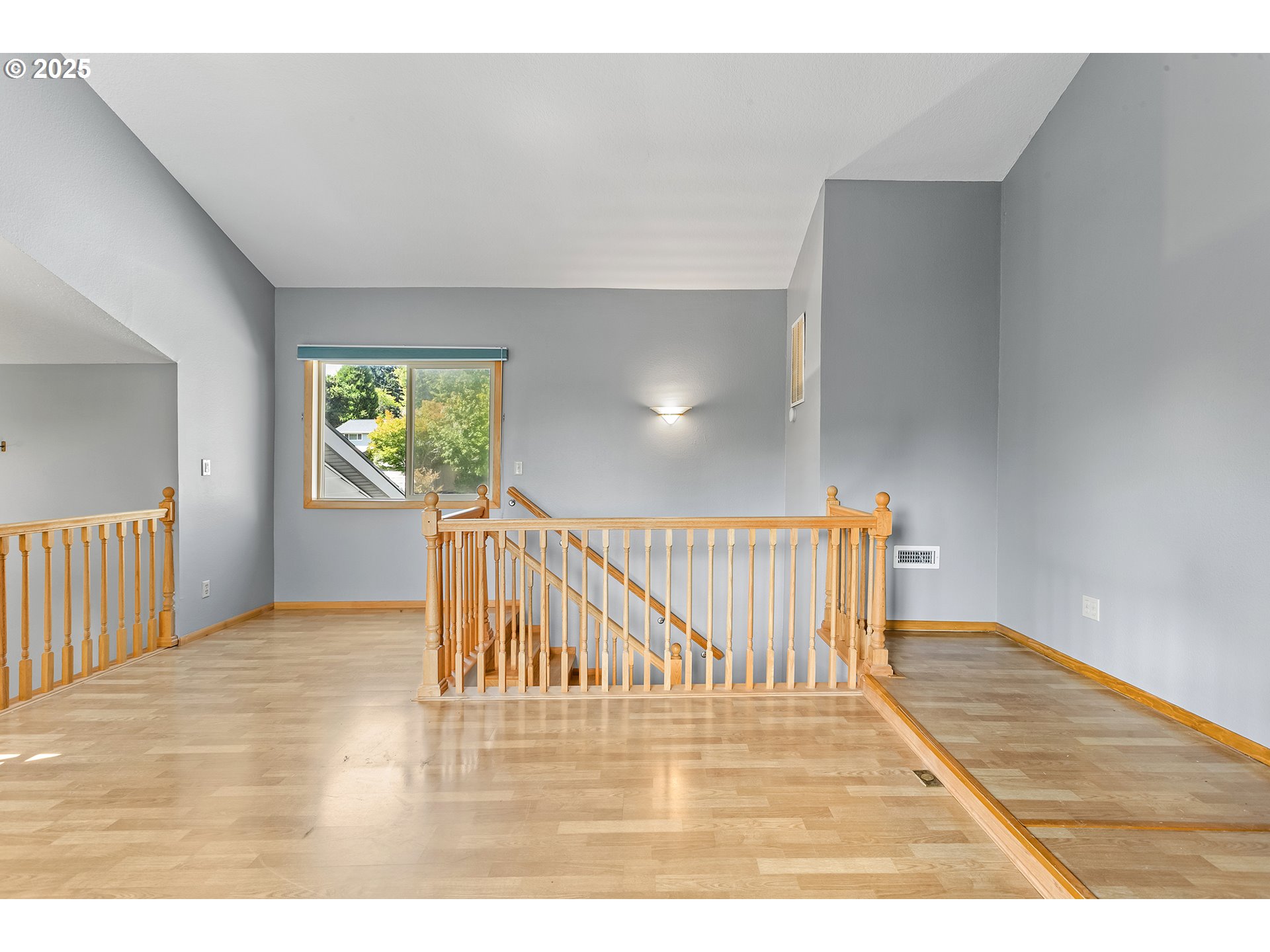 9630 Southwest Robbins Drive Beaverton, OR 97008 - Photo 27 of 35 a view of a hallway with wooden floor and windows