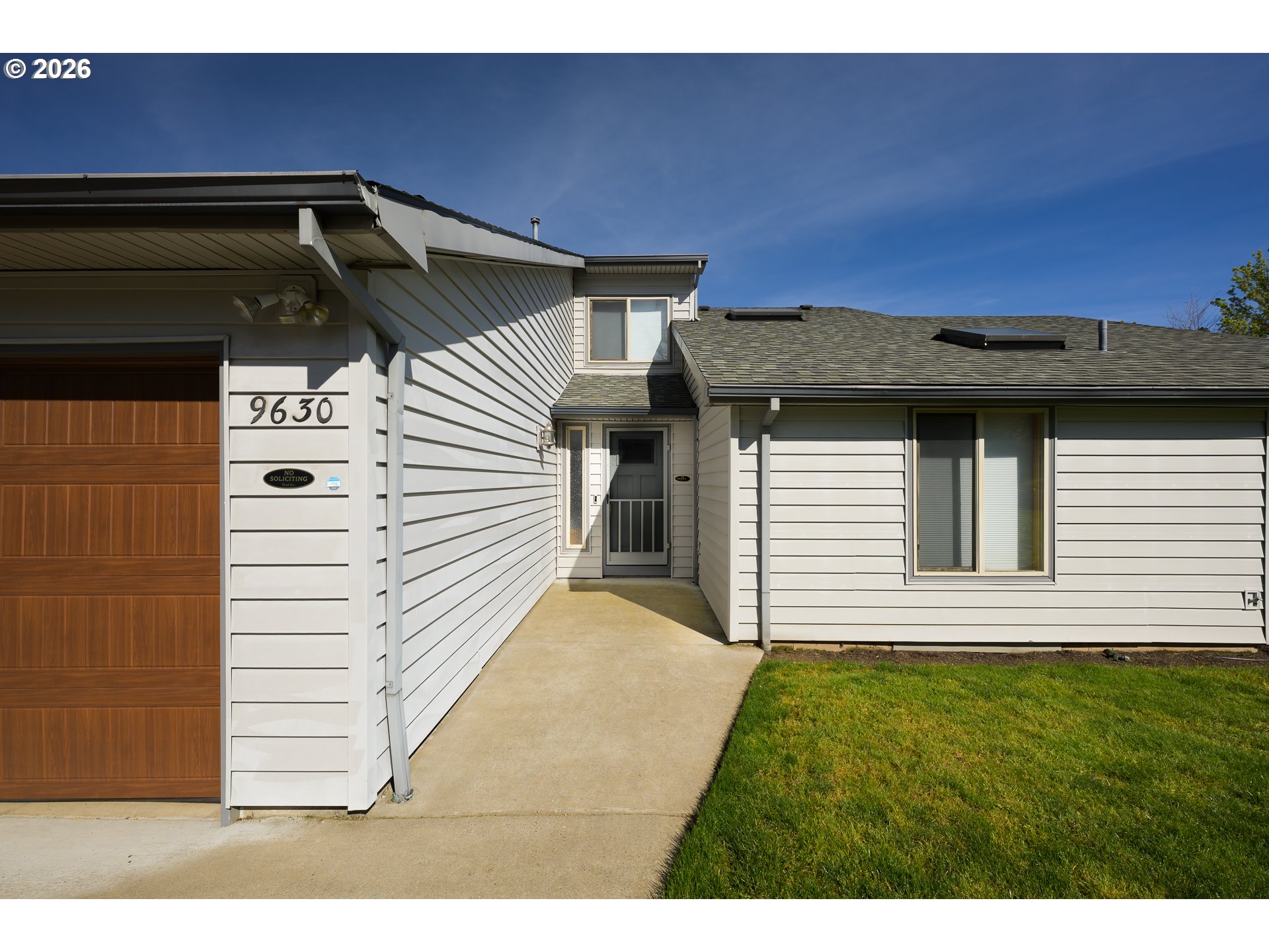9630 Southwest Robbins Drive Beaverton, OR 97008 - Photo 3 of 35 a front view of a house with a yard